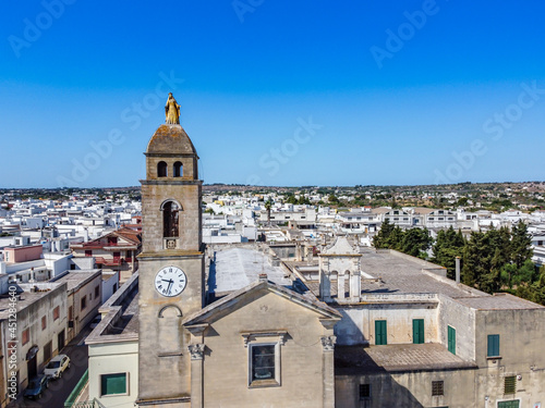 Close Up on the Madonna Golden Statue on the Belltower of the Santuario of Maria Addolorata shooted by Drone in the Town of Taviano