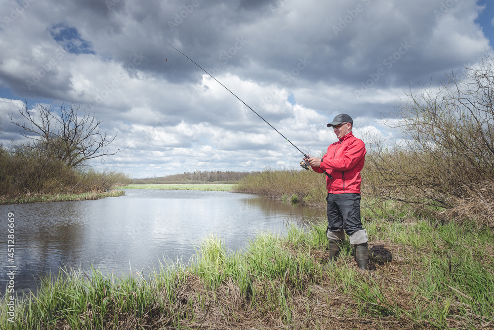 Fisherman on the banks of a picturesque river. Fisherman on the banks of a picturesque river.