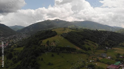 Aerial shot from drone on foggy summer morning in the mountains. Carpathian, Ukraine, Europe