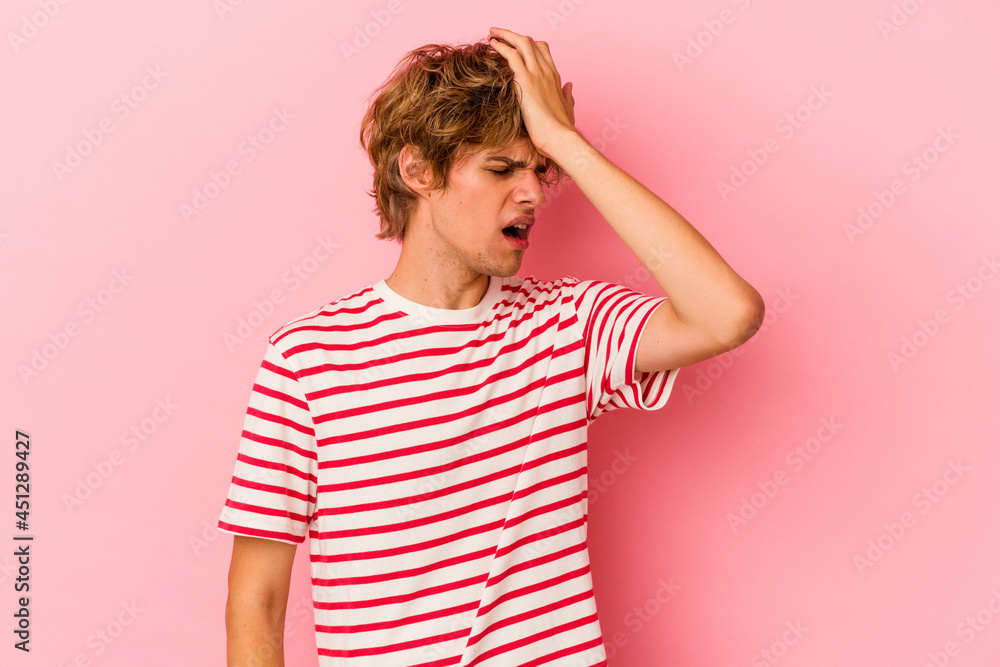 Young caucasian man with make up isolated on pink background forgetting something, slapping forehead with palm and closing eyes. Young caucasian man with make up isolated on pink background forgetting something, slapping forehead with palm and closing eyes.