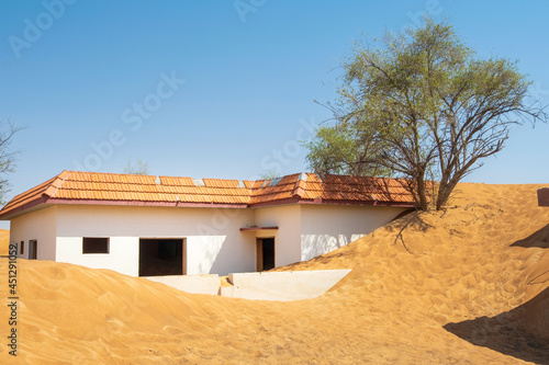 family house in sand dunes in lost village in UAE © sergejson