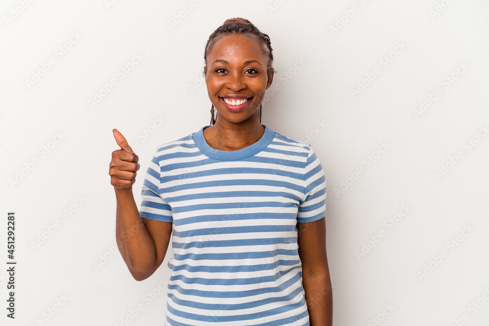 Fototapeta premium Young african american woman isolated on white background smiling and raising thumb up