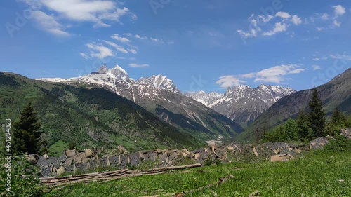 Time-lapse. Mt. Ushba double peak in the summertime