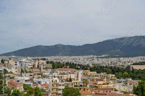 Cityscape of Athens at cloudy day. City near mountain. Urban architecture in Europe. View from top. © Anastasia