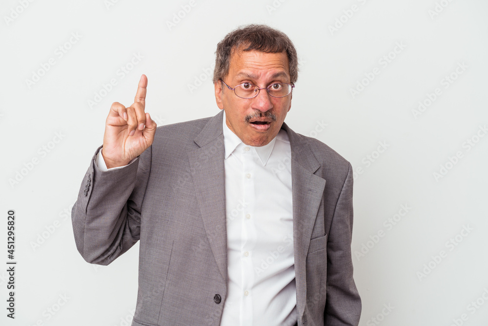 Middle aged indian business man isolated on white background having an idea, inspiration concept. Middle aged indian business man isolated on white background having an idea, inspiration concept.