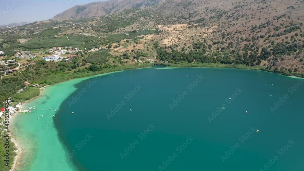 Aerial view of a large freshwater lake surrounded by arid mountains Aerial view of a large freshwater lake surrounded by arid mountains