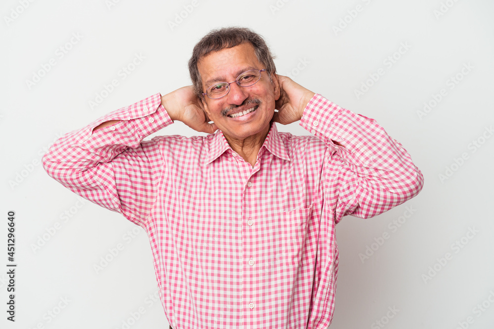Middle aged indian man isolated on white background stretching arms, relaxed position. Middle aged indian man isolated on white background stretching arms, relaxed position.