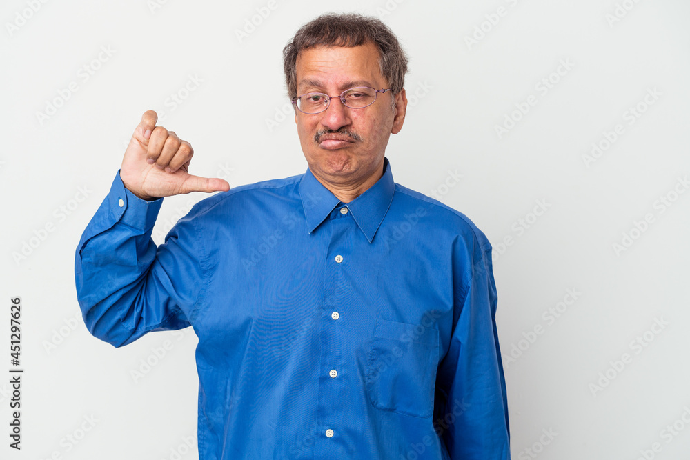 Middle aged indian man isolated on white background showing thumb down, disappointment concept.