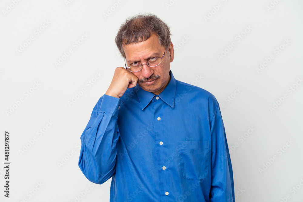 Middle aged indian man isolated on white background who feels sad and pensive, looking at copy space. Middle aged indian man isolated on white background who feels sad and pensive, looking at copy space.