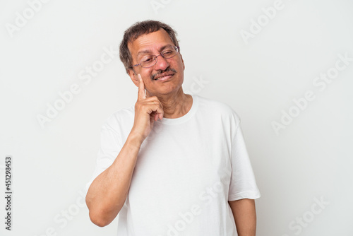 Middle aged indian man isolated on white background crying, unhappy with something, agony and confusion concept.
