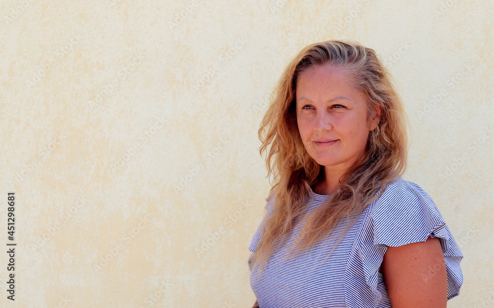 portrait of a pretty woman of 40 years with blonde hair of European appearance. portrait of a pretty woman of 40 years with blonde hair of European appearance.