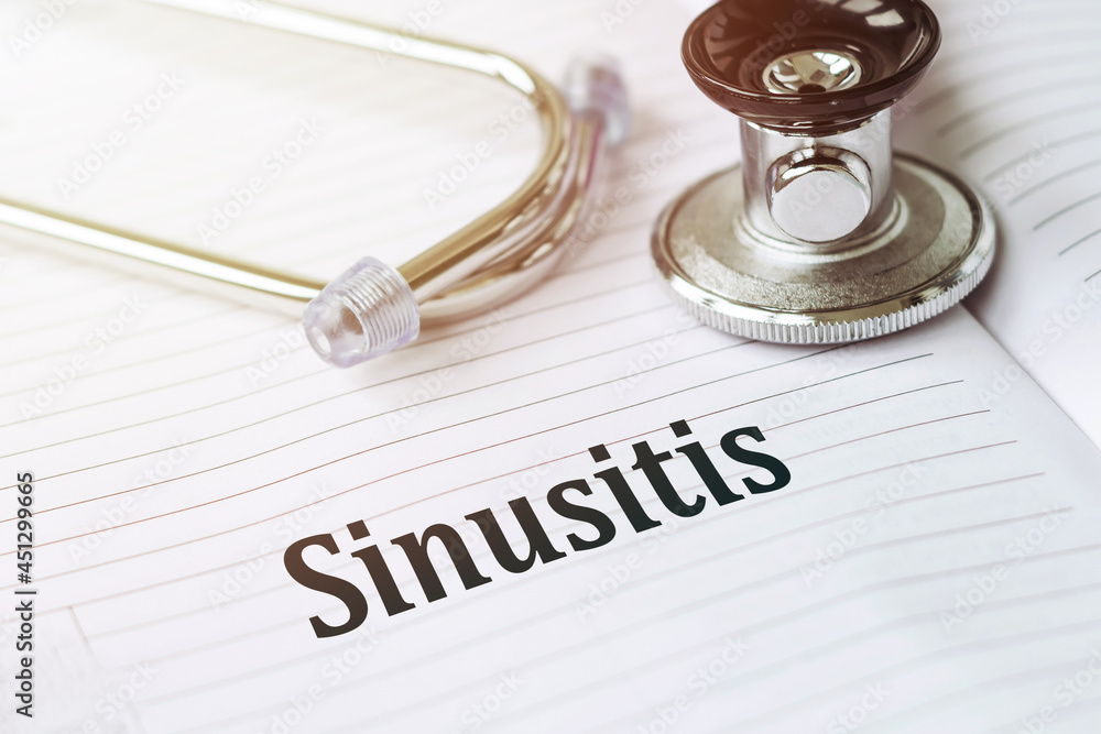 SINUSITIS. Text on a medical card next to a pen stethoscope. SINUSITIS. Text on a medical card next to a pen stethoscope.