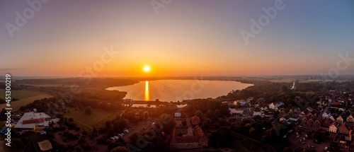 Sonnenaufgang in Bad Bederkesa. Norddeutschland zur Morgenstunde, Sommertag im Kurort. Panorama Luftaufnahme mit der Drohne. Aerial skyline view.   photo