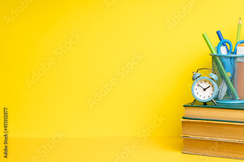 back to school concept. education stationery supply on yellow desktop. side view.