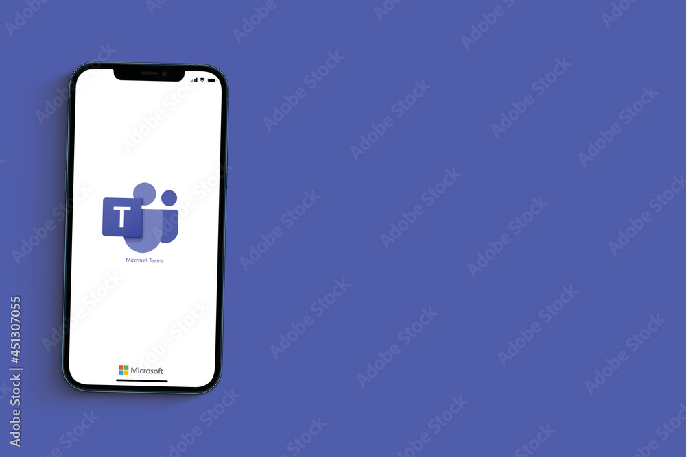 Foto Stock Microsoft Teams app on smartphone screen on blue background.  Communication and collaboration platform that combines chat, video  conferencing. Rio de Janeiro, RJ, Brazil. June 2021. | Adobe Stock