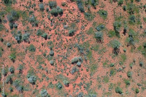 Outback Australia aerial drone wide shot over the picturesque wild rural dry red center desert landscape of Western Australia