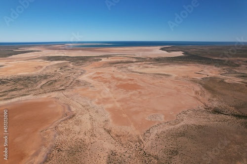 Outback Australia aerial wide shot over the picturesque dry drought affected river lake environment desert landscape of Western Australia