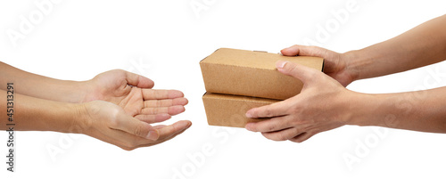 Hand give takeaway cardboard food boxes to other hand isolated on white