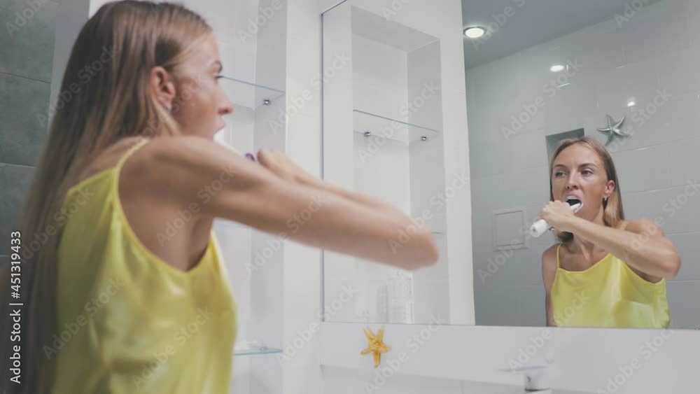 Toothpaste. European girl, white woman, brush her teeth before bed and morning. Healthy life concept. Toothpaste. European girl, white woman, brush her teeth before bed and morning. Healthy life concept.