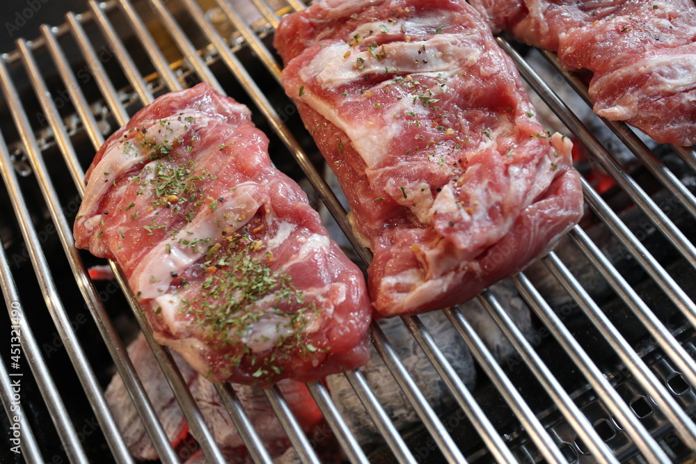 Pork BBQ tenderloin steak sprinkled with herb powder. Pork BBQ tenderloin steak sprinkled with herb powder.