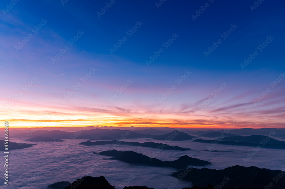 Landscape and starscape of the mountain and sea of mist in winter sunrise view from top of Phu Chi Dao mountain , Chiang Rai, Thailand