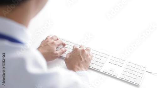 back view of man using keyboard