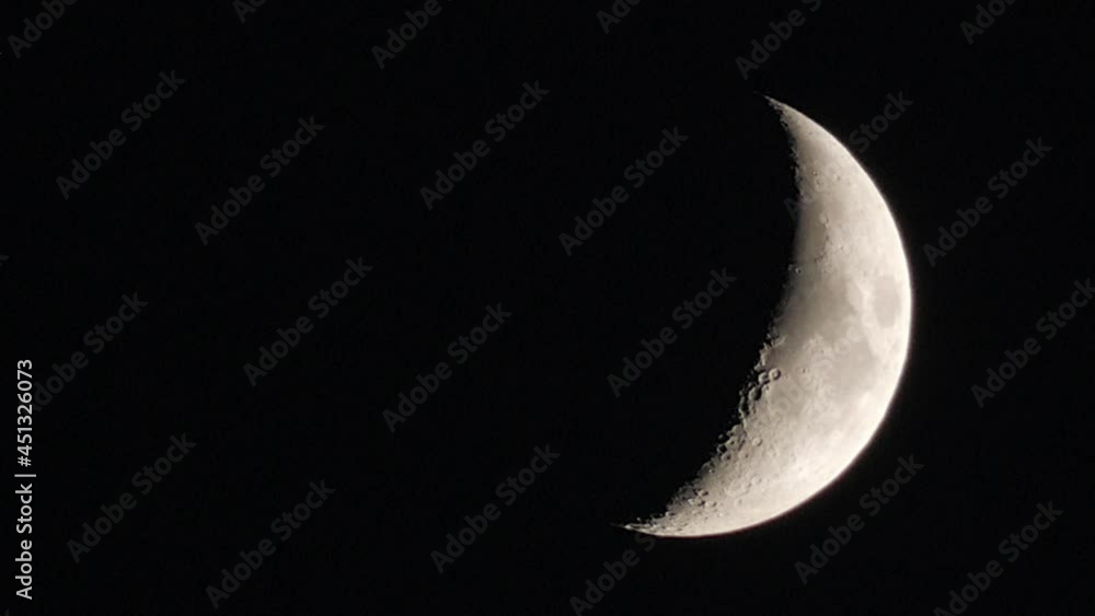 Close Up View Of Crescent Moon Slowly Moving Down At The Night Sky. Close Up View Of Crescent Moon Slowly Moving Down At The Night Sky.