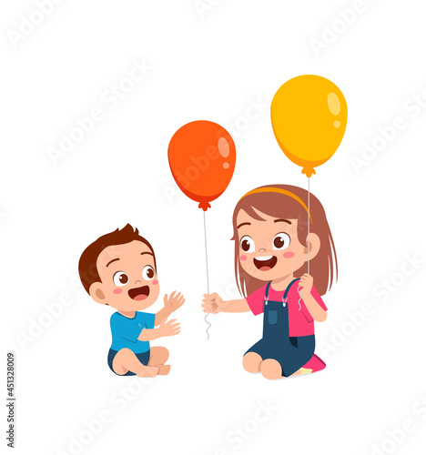 cute little girl play balloon with baby sibling
