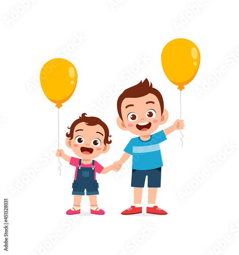 cute little boy play balloon with baby sibling