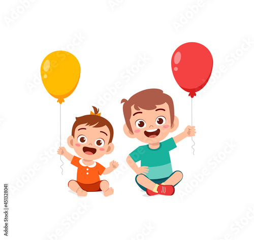 cute little boy play balloon with baby sibling