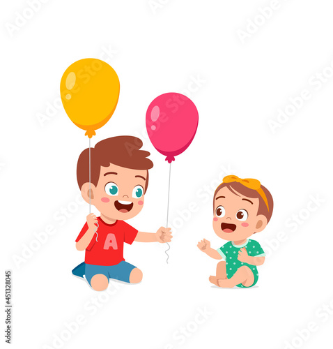 cute little boy play balloon with baby sibling