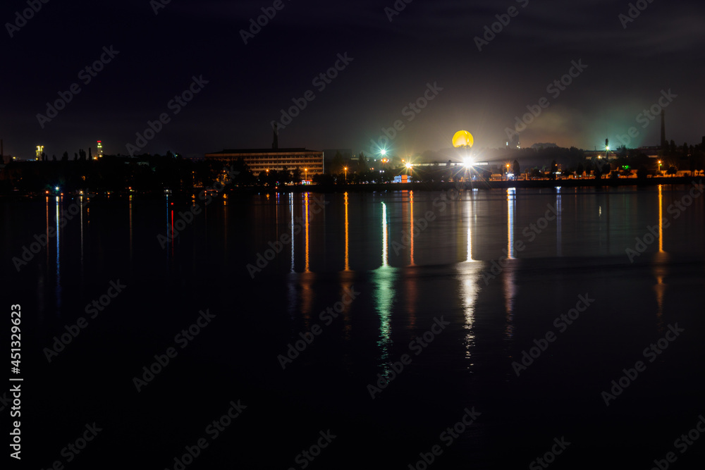 Night view of the Dnieper river and Dnipro city in Ukraine