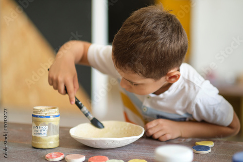 workshop for kids. Children learning how to use clay for making beautiful dishes. Workshop, master class.