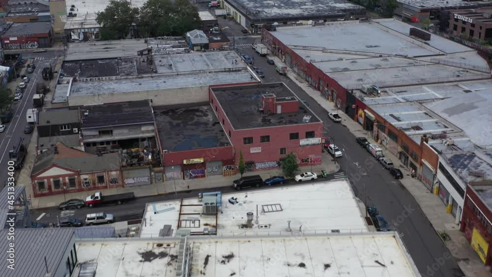 Quick and fast aerial flight over Brooklyn New York warehouse rooftops in the Bushwick neighborhood Quick and fast aerial flight over Brooklyn New York warehouse rooftops in the Bushwick neighborhood