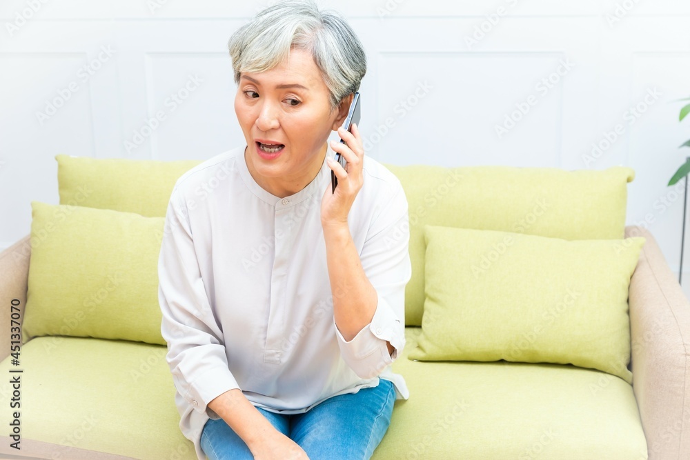 Senior asian woman holding Cell phone using mobile online apps. Senior asian woman holding Cell phone using mobile online apps.