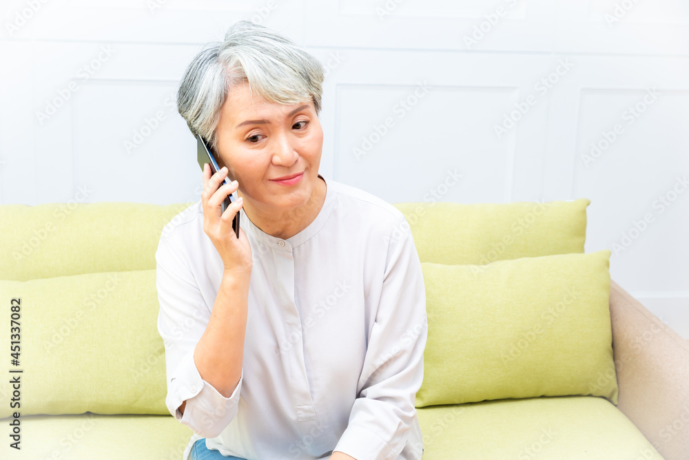 Senior asian woman holding Cell phone using mobile online apps. Senior asian woman holding Cell phone using mobile online apps.
