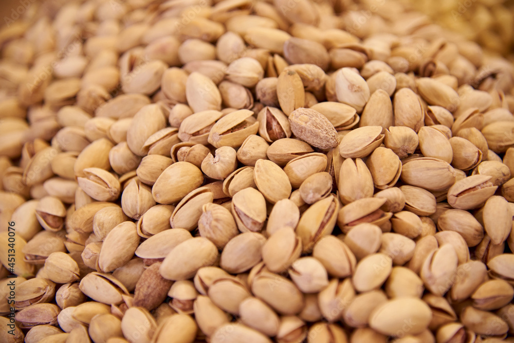 lots of fried pistachios, nuts lots of fried pistachios, nuts