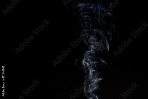Light smoke on a black background. Cigarette smoke.Background. Place for the text