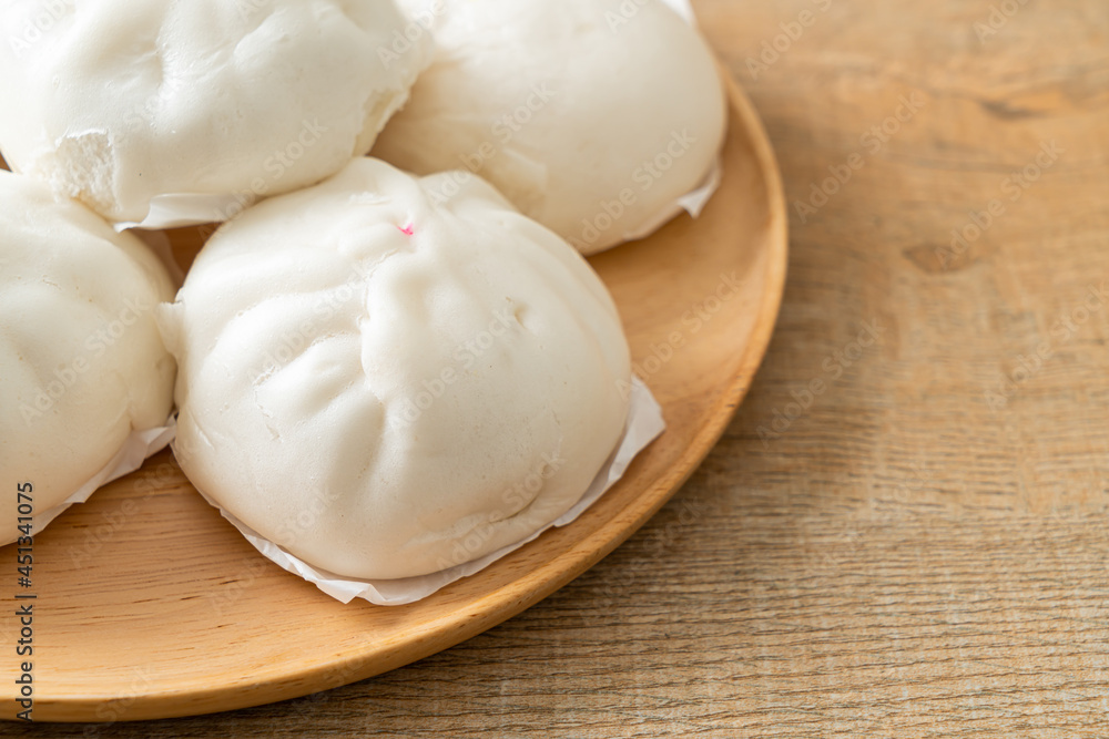 stuffed steamed bun on wood plate stuffed steamed bun on wood plate