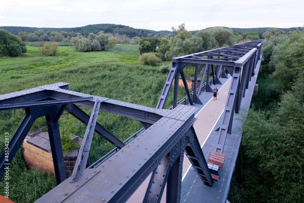 Siekierki, Poland August 17, 2021. A new bicycle route along the historic bridge on the border of Poland and Germany from Siekierki-Neurüdnitz. Siekierki, Poland August 17, 2021. A new bicycle route along the historic bridge on the border of Poland and Germany from Siekierki-Neurüdnitz.