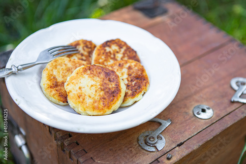 pancake syrniki sweet pancakes cottage cheese breakfast outdoor meal snack on the table copy space food background rustic top view keto or paleo diet