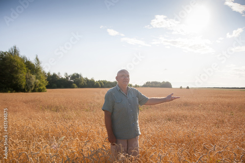 Portrait of   elderly male farmer   in   wheat field © DariaTrofimova