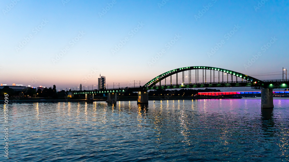 Naklejka premium Belgrade, Serbia - July 27, 2021: View of the Bridge on the Sava river from Belgrade Waterfront at night