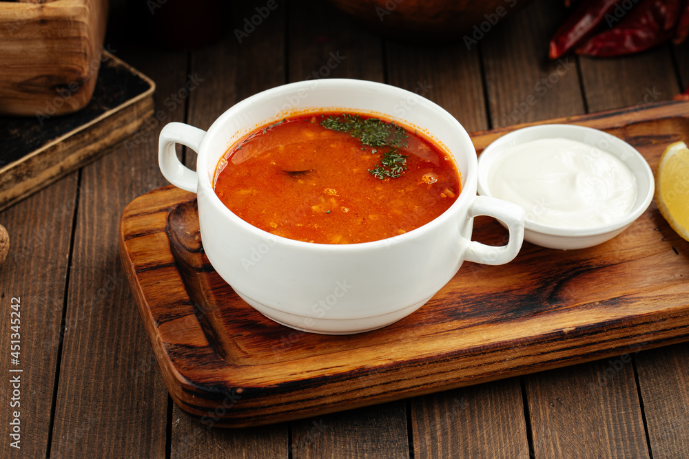 Russian dish solyanka prefabricated meat soup with sour cream Russian dish solyanka prefabricated meat soup with sour cream