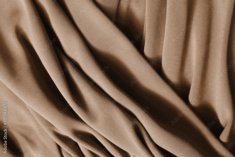 Fototapeta premium Smooth elegant beige satin texture as abstract background. Luxurious background design.