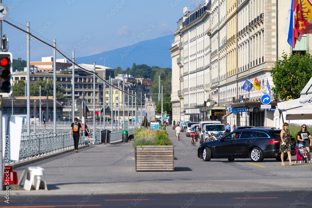 Fototapeta premium Lake Geneva and river Rhone at City of Geneva on sunny summer morning. Photo taken July 29th, 2021, Geneva, Switzerland.