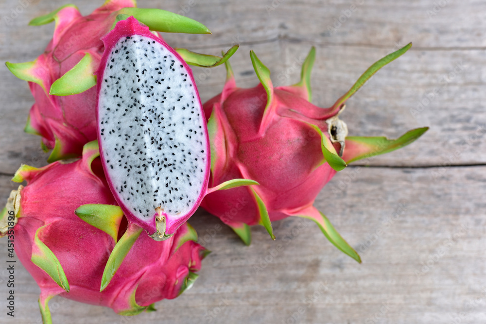 Dragon fruit on old wood background Healthy fruits. top view Dragon fruit on old wood background Healthy fruits. top view