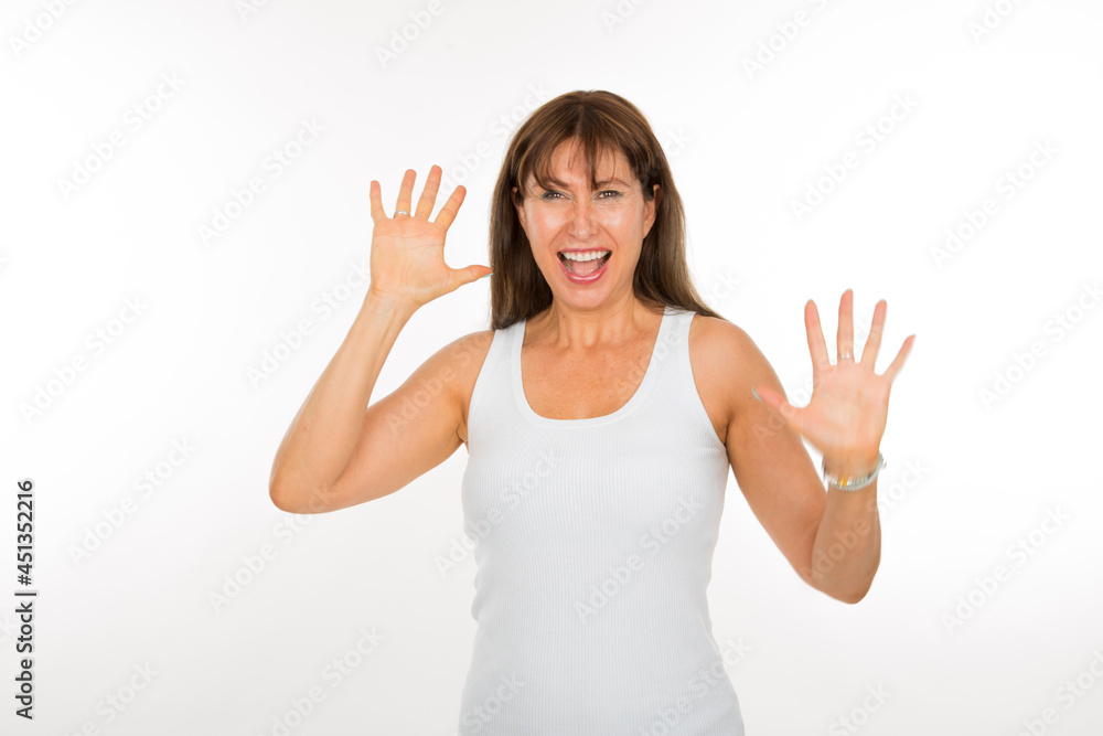 portrait caucasian senior woman with joy expression with hands up on white background portrait caucasian senior woman with joy expression with hands up on white background