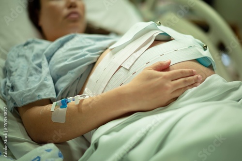 Quadro em tela A pregnant woman being induced in the hospital, with iv and contractions monitor