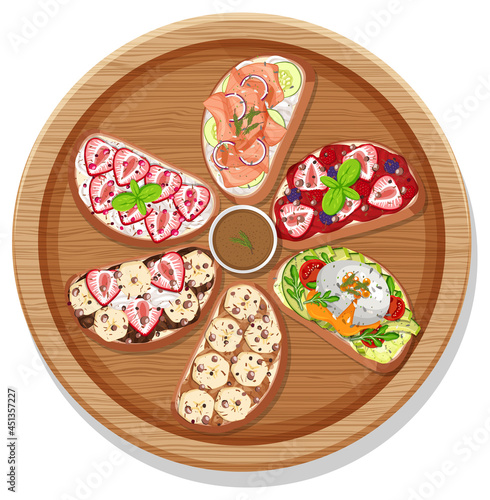 Top view of different bruschetta on a round plate isolated